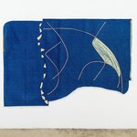 Photo of a a blue artwork made of fabric with yarn and other materials overlaid in abstract forms.