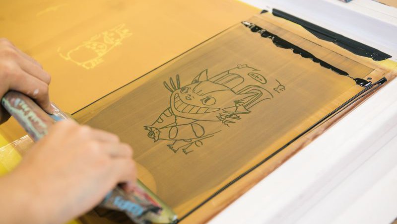 Student works on screen printing design with black ink__Turn an idea into material form_horizontal feature_MB