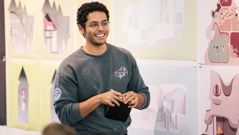 Architecture Student presenting their renderings during open crit