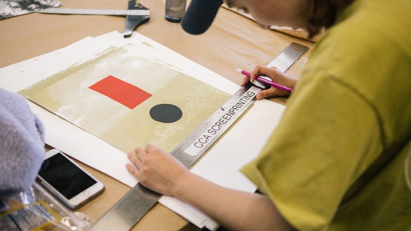 Printmaking student measures their design_horizontal feature_MB