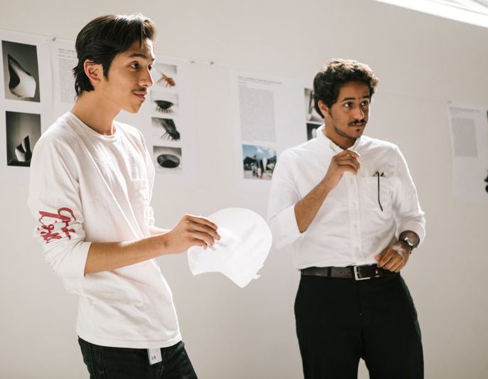 Architecture student presenting their design and models during class crit_hero needs higher res_MB