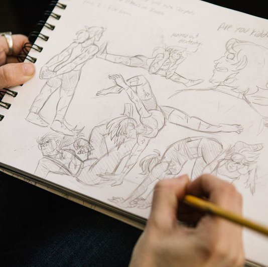 Student working on animation sketches during class.