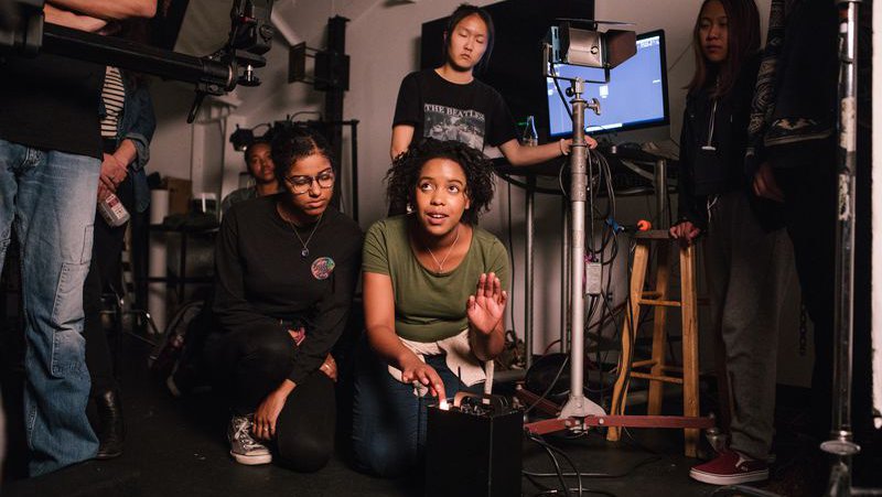 Photography students learn to adjust lighting and stage photoshoots